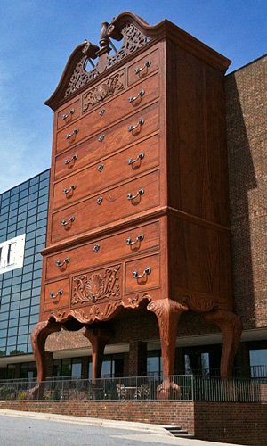 A High Point, North Carolina building façade shaped like a towering carved highboy chest of drawers