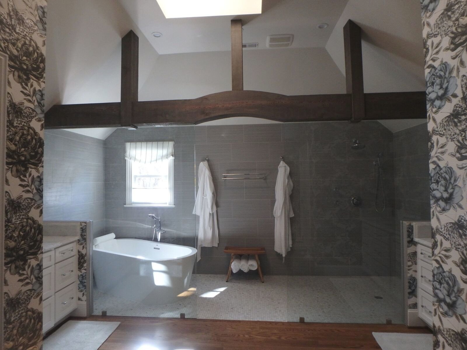 Irving Park primary bath with timber beams, a freestanding tub and an open glass shower