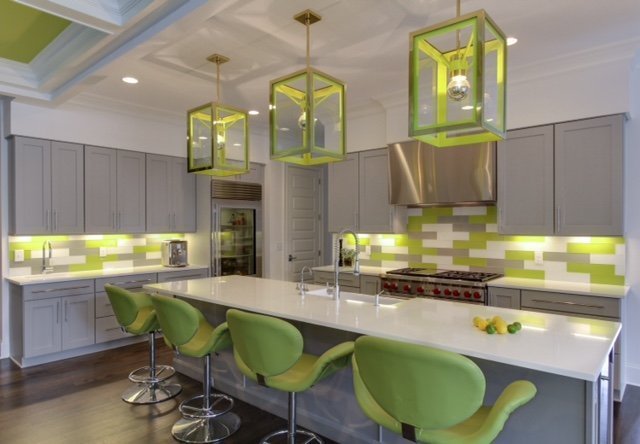 Kitchen with chartreuse lantern pendants, a chartreuse and gray tile backsplash and green swivel barstools
